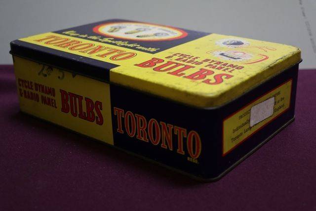 A Tornto Bulbs Dispensing Tin With Partial Contents 
