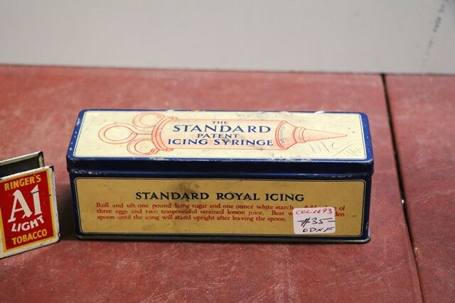 A Vintage Standard Icing Syringe Tin With Contents