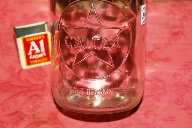 Vintage Caltex Embossed 1qt Oil Bottle 