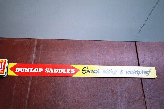 Vintage Dunlop Saddles Shelf Strip Sign 
