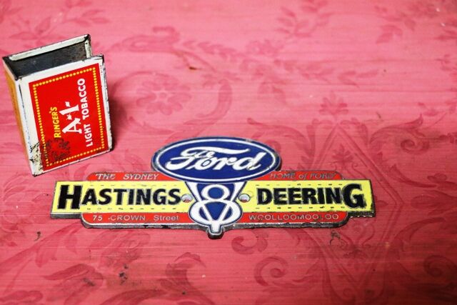 Vintage Ford Hastings and Deering Enamel Badge