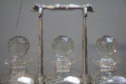 Antique Victorian Cut Glass 3 Bottle Tantalus in a Silver Plated 