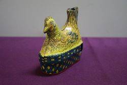 A Baldwin MFG Company Clockwork Tinplate Model Of A Hen Nesting 