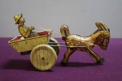 A Mark Toys Clockwork Tinplate Model Of A Donkey Pulling A Cart  