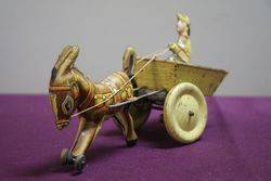 A Mark Toys Clockwork Tinplate Model Of A Donkey Pulling A Cart  