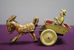 A Mark Toys Clockwork Tinplate Model Of A Donkey Pulling A Cart  