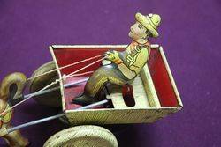 A Mark Toys Clockwork Tinplate Model Of A Donkey Pulling A Cart  