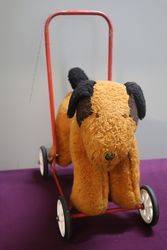 A Push-Along Soft Toy Dog On Wheels 