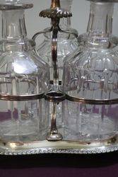 Cut Glass 3 Bottle Tantalus in a Silver Plated Stand