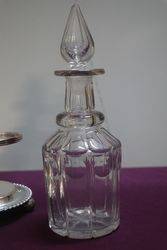 Cut Glass 3 Bottle Tantalus in a Silver Plated Stand