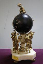 French Bell Strike Clock In Round Black Ball On top Of Cherubs 