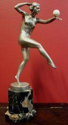 A Genuine Art Deco Silver Bronze Figure with Ivory Ball