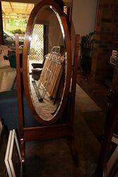 A Vintage Oval Beveled Glass Cheval Mirror. #