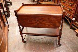 Early C20th Oak Drop side Tea Trolley. #