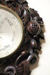 A Very Large Antique profusely carved oak barometer 
