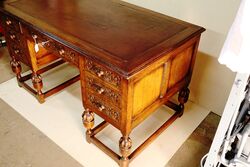 Early C20th Carved Oak 7 Drawer Writing Desk