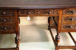 Early C20th Carved Oak 7 Drawer Writing Desk