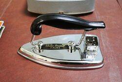 A Cased FALKS GlobeTrotter Traveling Iron