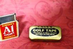 A Small Cave's Golf Tape Tin.