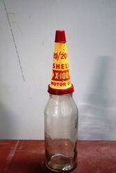 Early Shell One Quart Bottle with X100 Tin Top & Dust Cap.