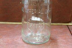 Embossed Shell Quart Oil Bottle With Tin Top