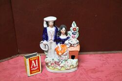 Small C19th Staffordshire Boy with Girl Figure. #